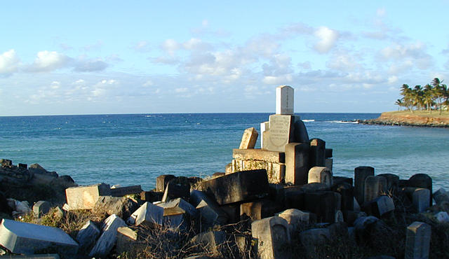 gravestones piled by the shore